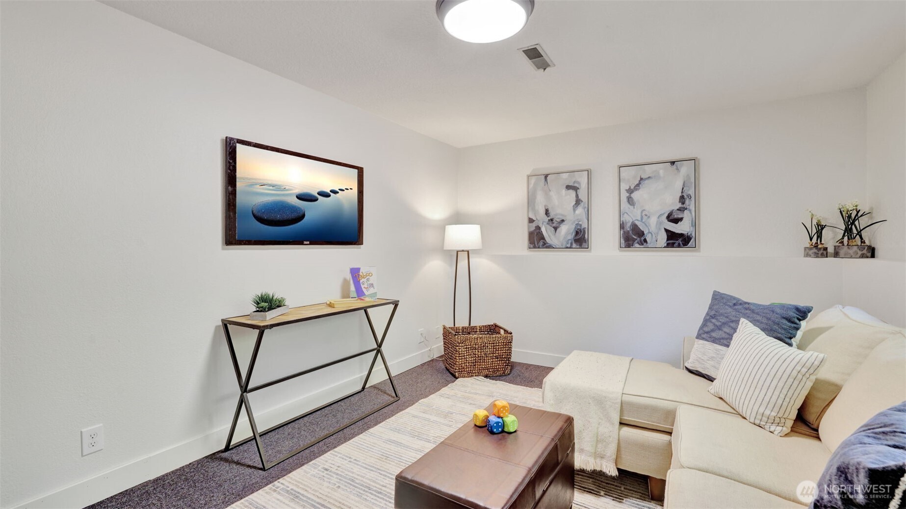 19134 Southeast May Valley Road Issaquah, WA 98027 - Photo 12 of 30 a living room with furniture and a flat screen tv