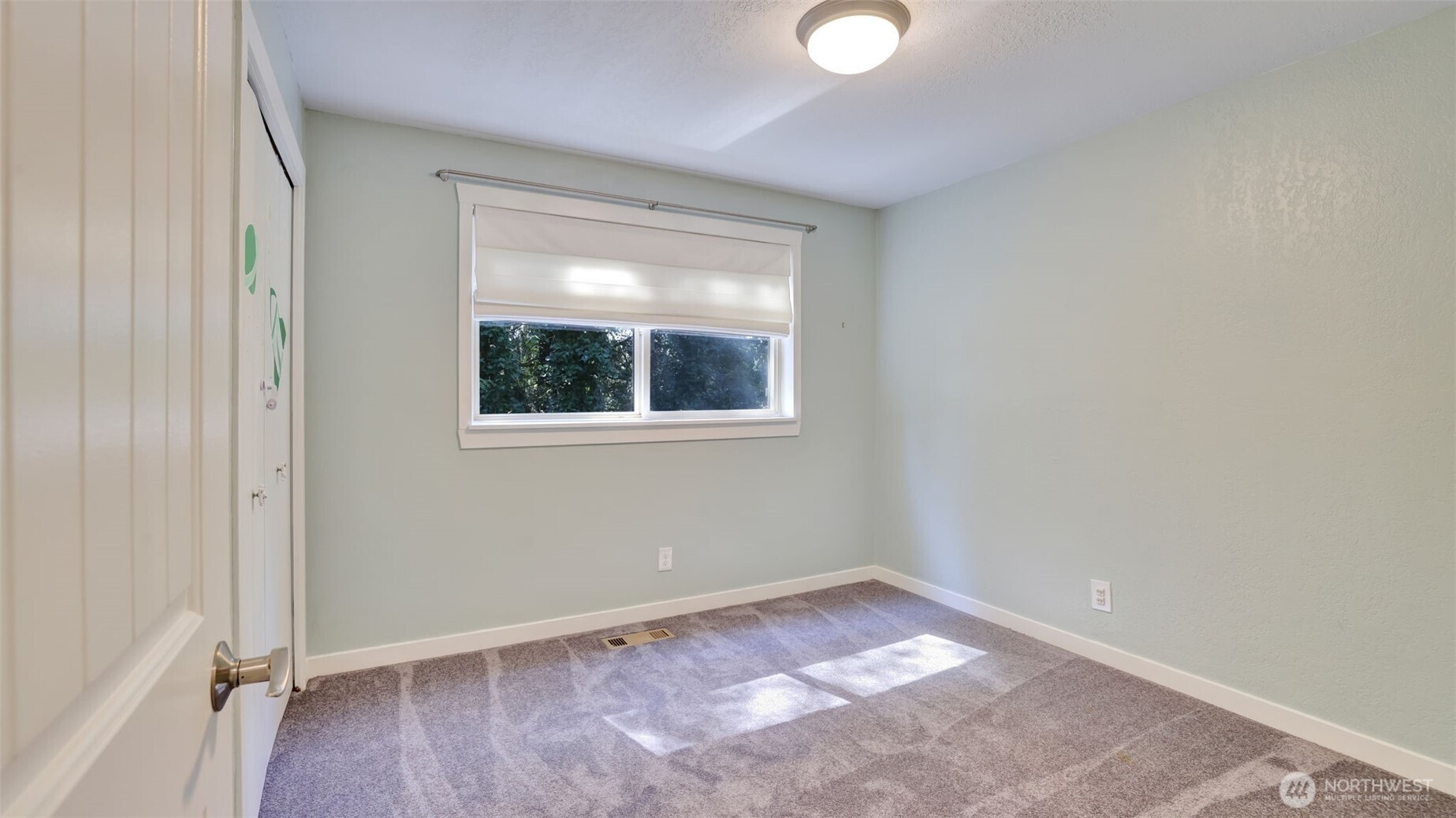 19134 Southeast May Valley Road Issaquah, WA 98027 - Photo 17 of 30 an empty room with a window