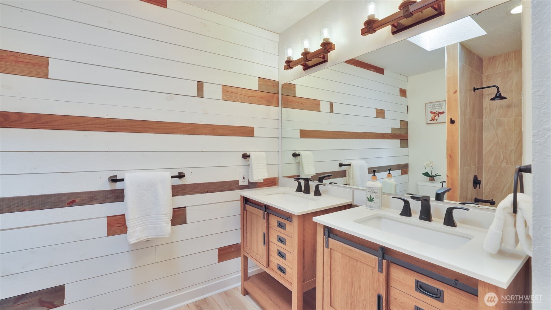 19134 Southeast May Valley Road Issaquah, WA 98027 - Photo 19 of 30 a bathroom with a sink and a mirror