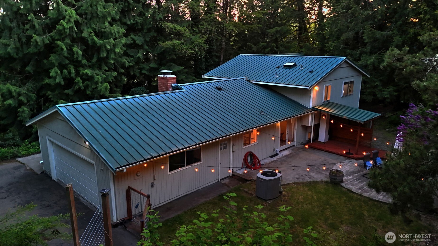 19134 Southeast May Valley Road Issaquah, WA 98027 - Photo 2 of 30 an aerial view of a house with swimming pool and deck back yard