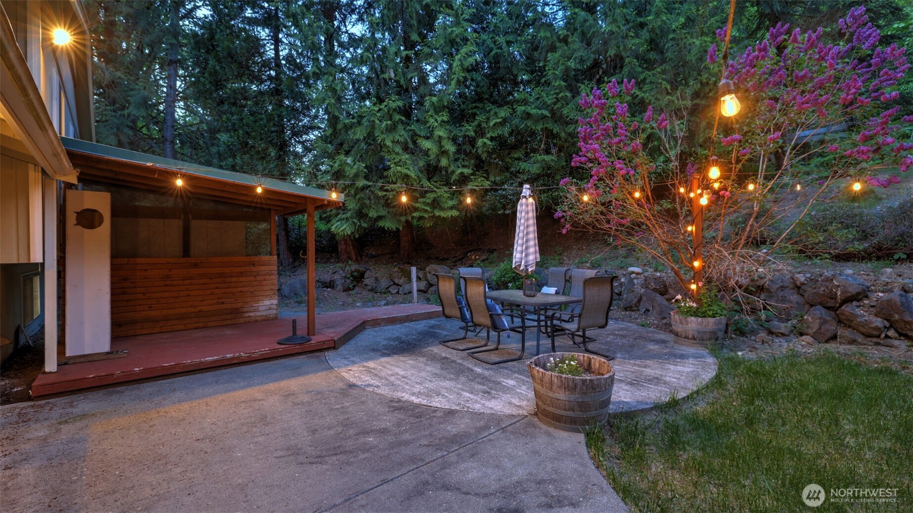 19134 Southeast May Valley Road Issaquah, WA 98027 - Photo 22 of 30 a view of a backyard with sitting area and fire pit