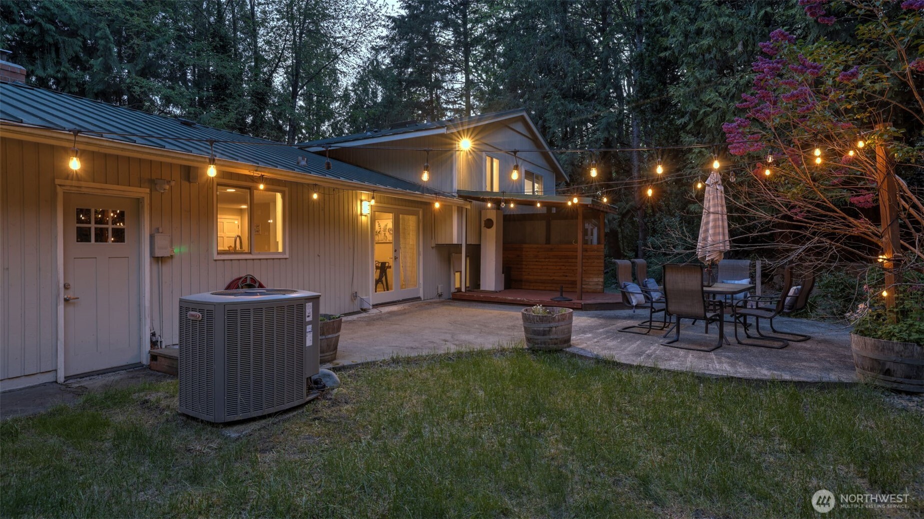 19134 Southeast May Valley Road Issaquah, WA 98027 - Photo 23 of 30 a view of a patio with a table and chairs