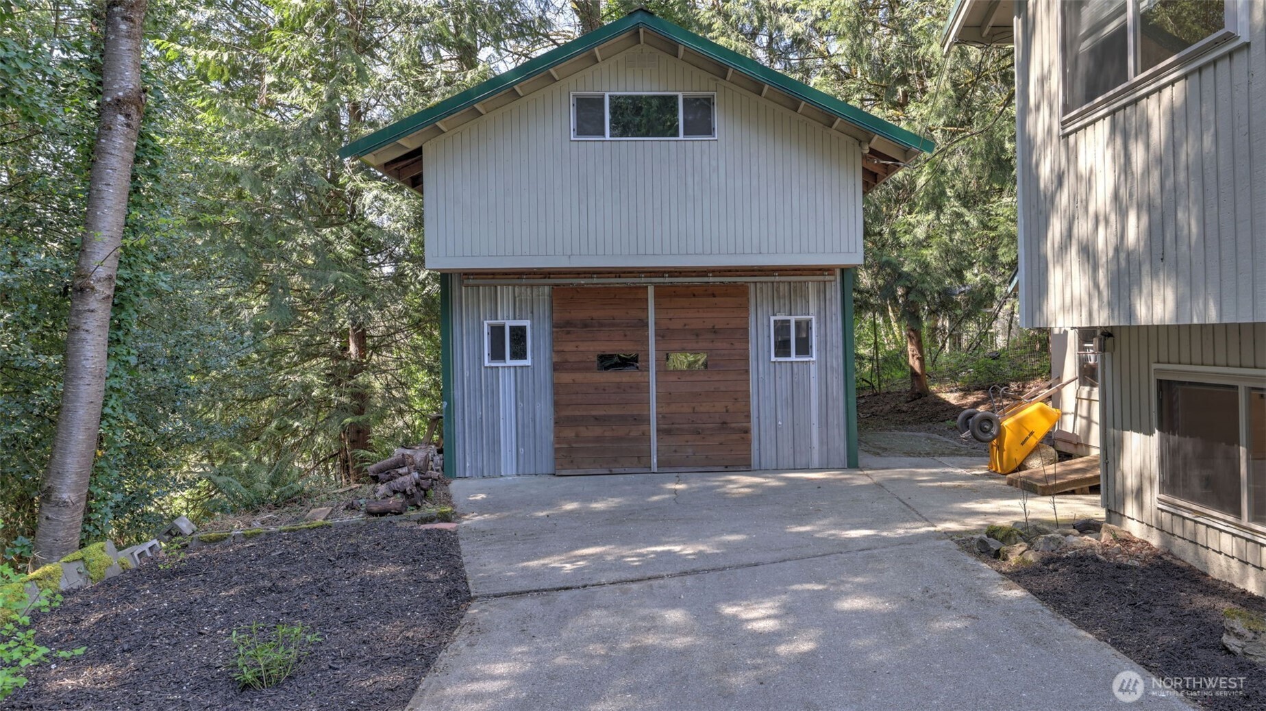 19134 Southeast May Valley Road Issaquah, WA 98027 - Photo 24 of 30 a view of a house with backyard and porch