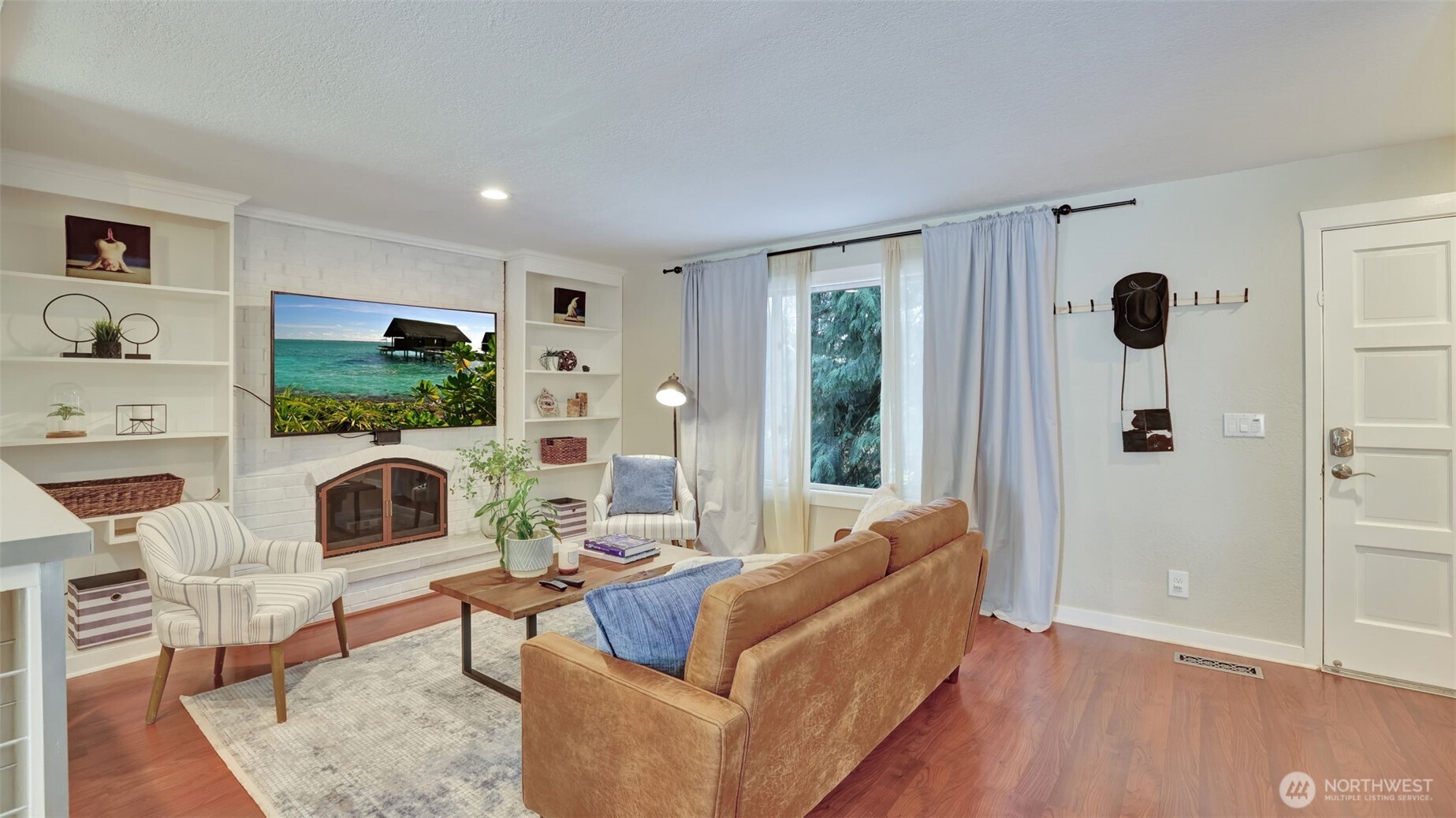 19134 Southeast May Valley Road Issaquah, WA 98027 - Photo 4 of 30 a living room with furniture and a fireplace