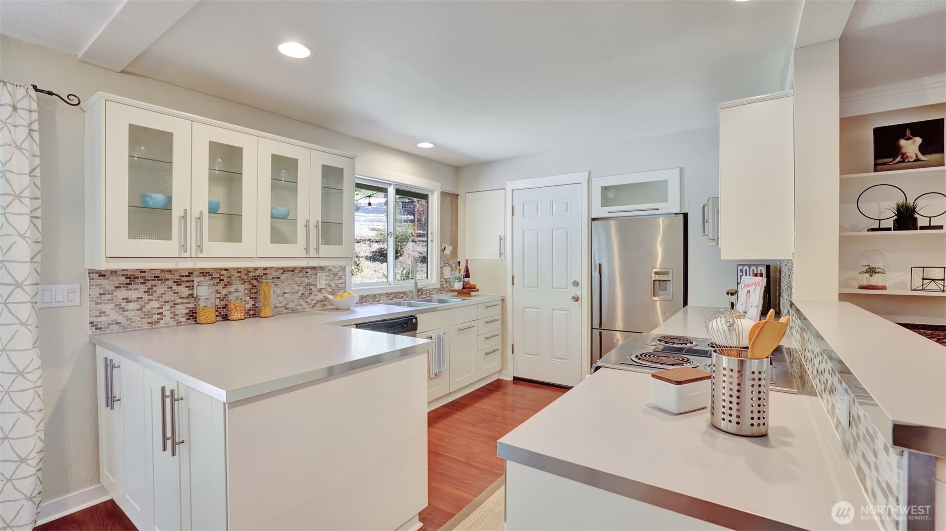 19134 Southeast May Valley Road Issaquah, WA 98027 - Photo 6 of 30 a kitchen that has a sink and a stove in it