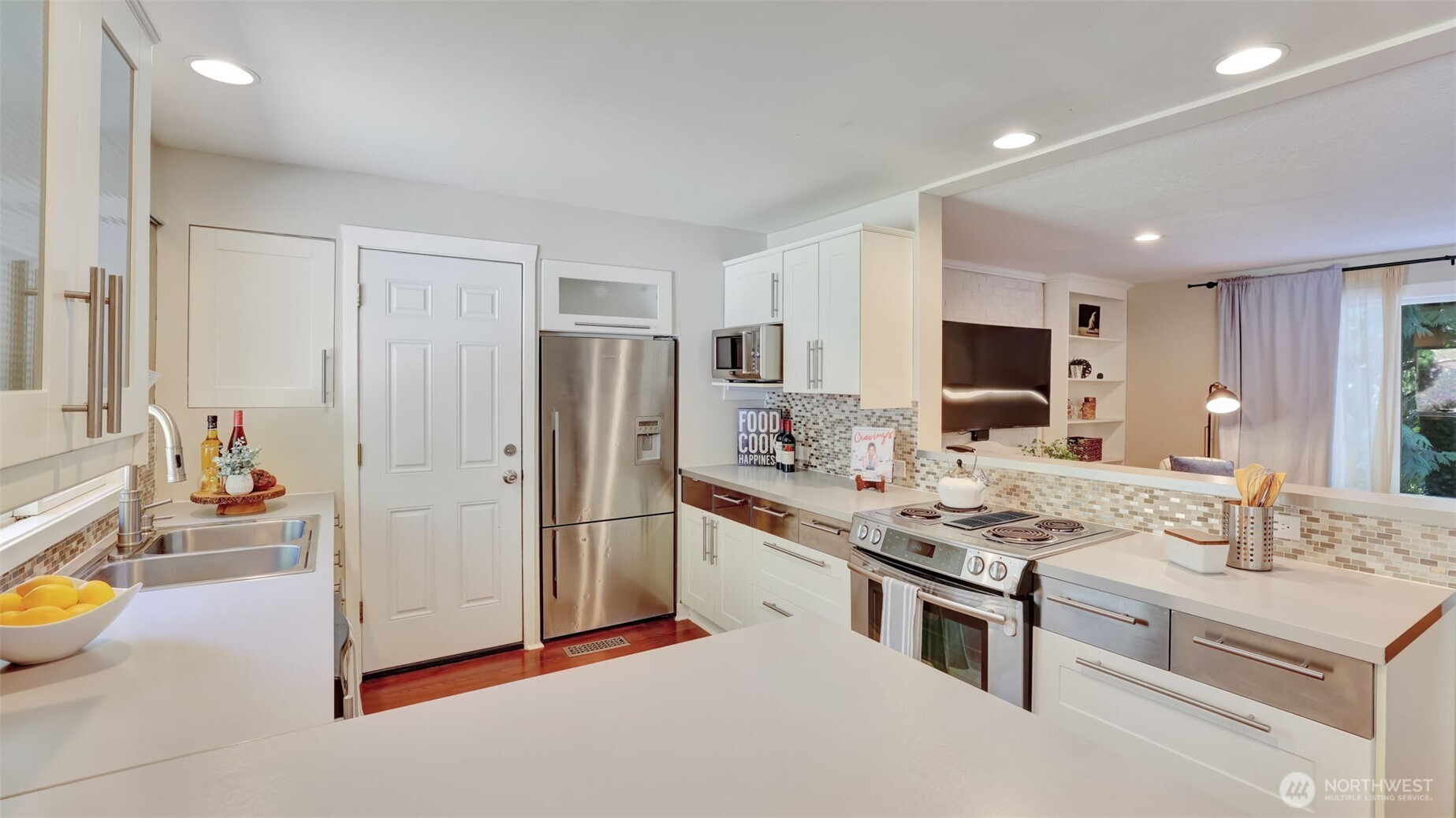 19134 Southeast May Valley Road Issaquah, WA 98027 - Photo 7 of 30 a kitchen with stainless steel appliances granite countertop a stove refrigerator and a sink