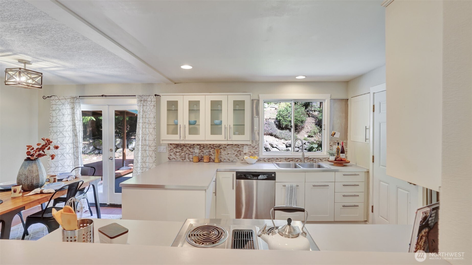 19134 Southeast May Valley Road Issaquah, WA 98027 - Photo 9 of 30 a kitchen with a sink and cabinets