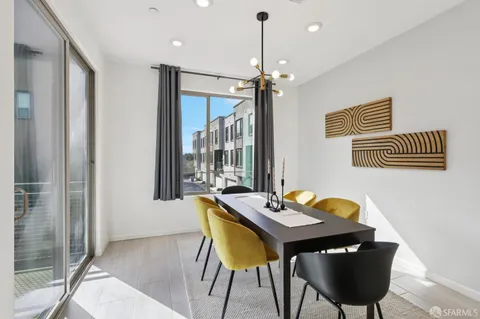 a view of a dining room with furniture and window