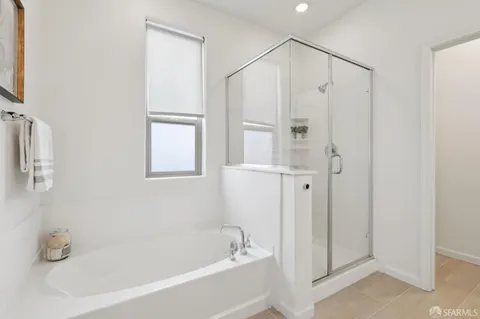 a bathroom with a bathtub and a shower