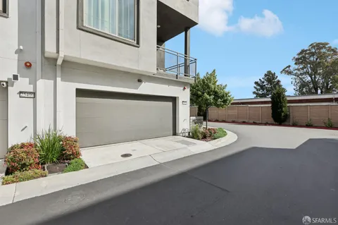 a front view of a house with potted plants and a potted plant