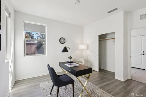 a view of a livingroom with furniture and wooden floor