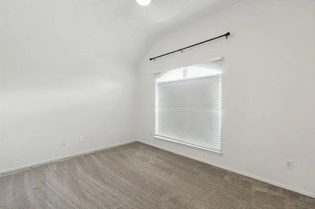 an empty room with a empty space and mirror