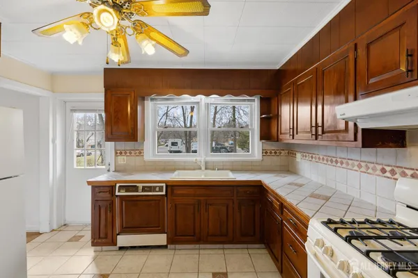 a kitchen with a sink and a stove