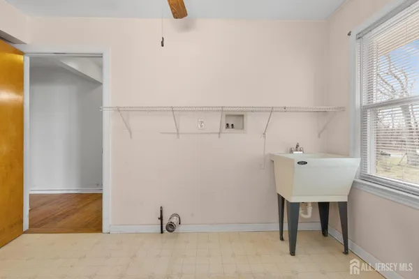 a bathroom with a sink and a window