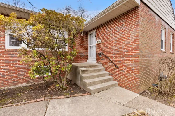 a view of a pathway with a house in the background