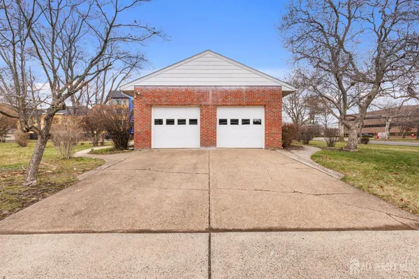 a view of a building with a yard