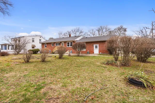 a large tree in front of the house