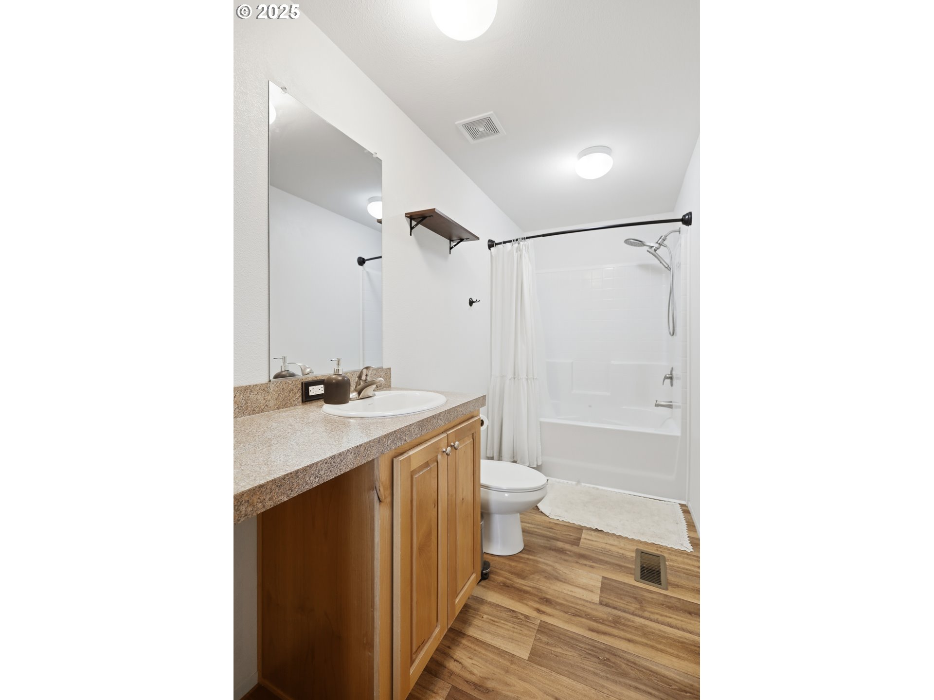 1924 Jaxon Street Goldendale, WA 98620 - Photo 11 of 24 a bathroom with a sink toilet a shower and a mirror