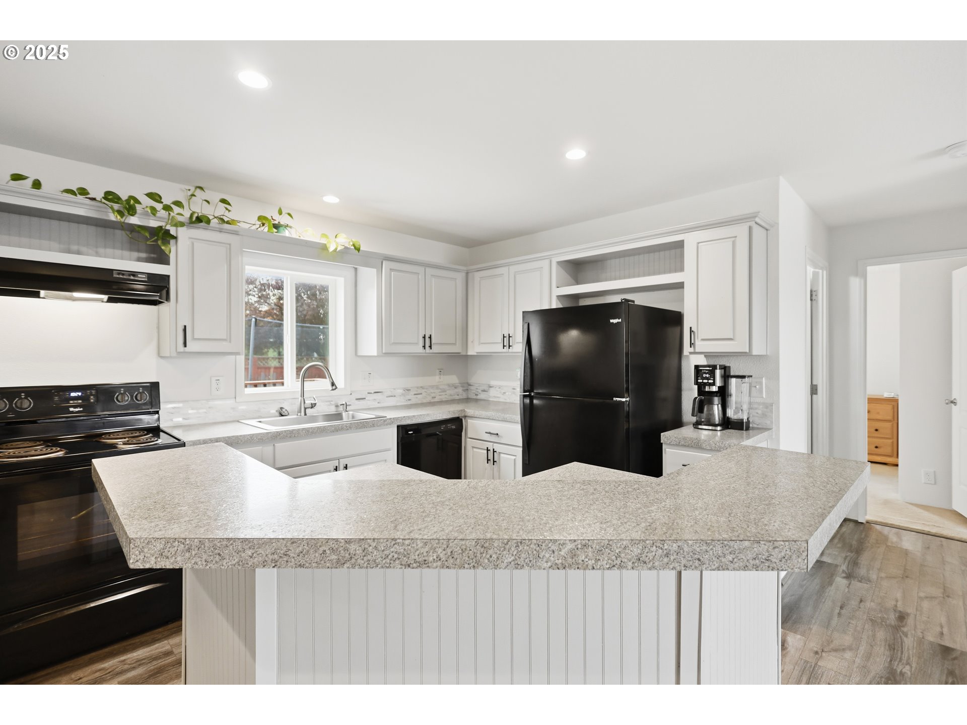 1924 Jaxon Street Goldendale, WA 98620 - Photo 5 of 24 a kitchen with granite countertop a sink a stove and refrigerator