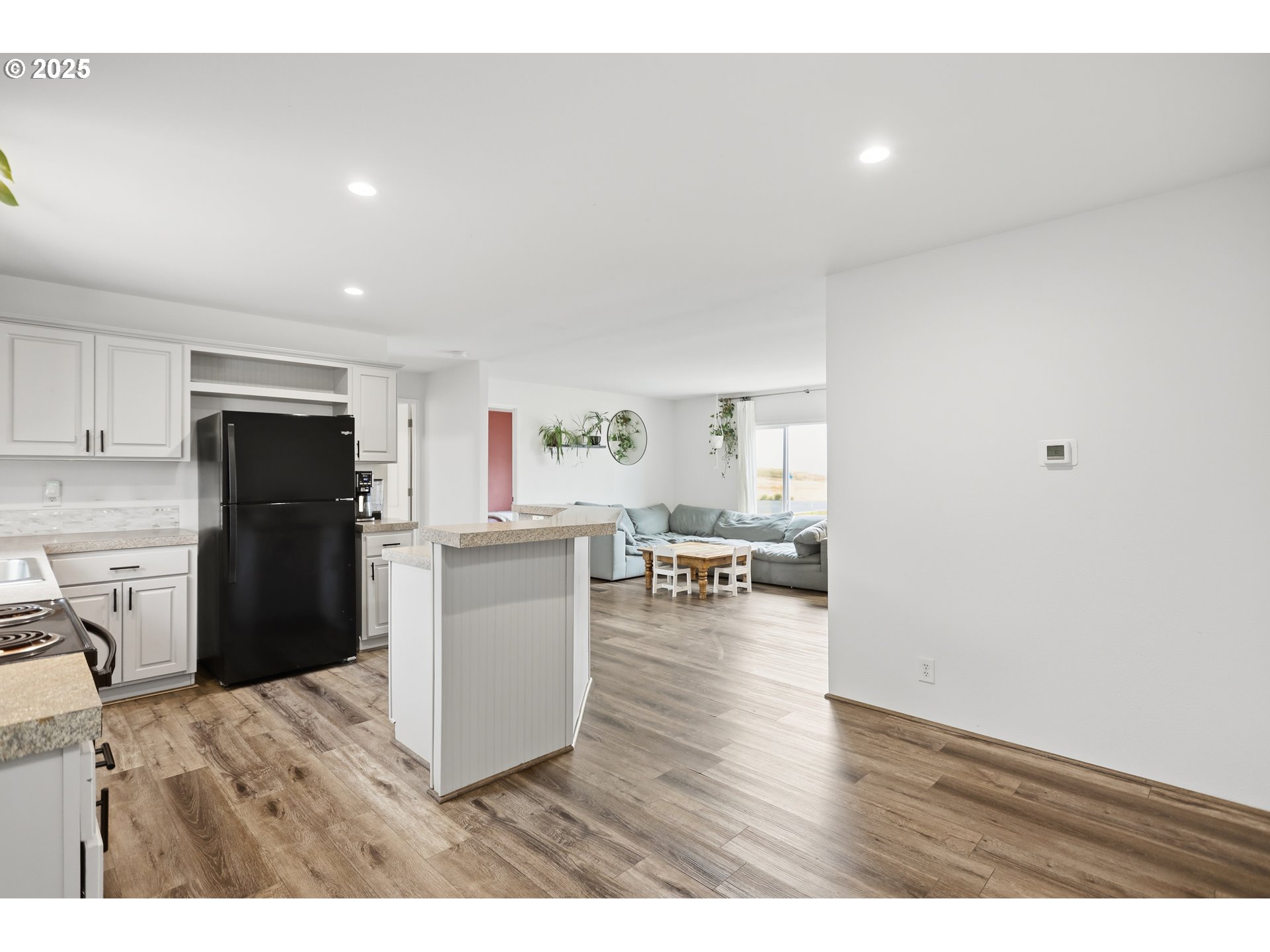 1924 Jaxon Street Goldendale, WA 98620 - Photo 8 of 24 a kitchen with a refrigerator and a wooden cabinets