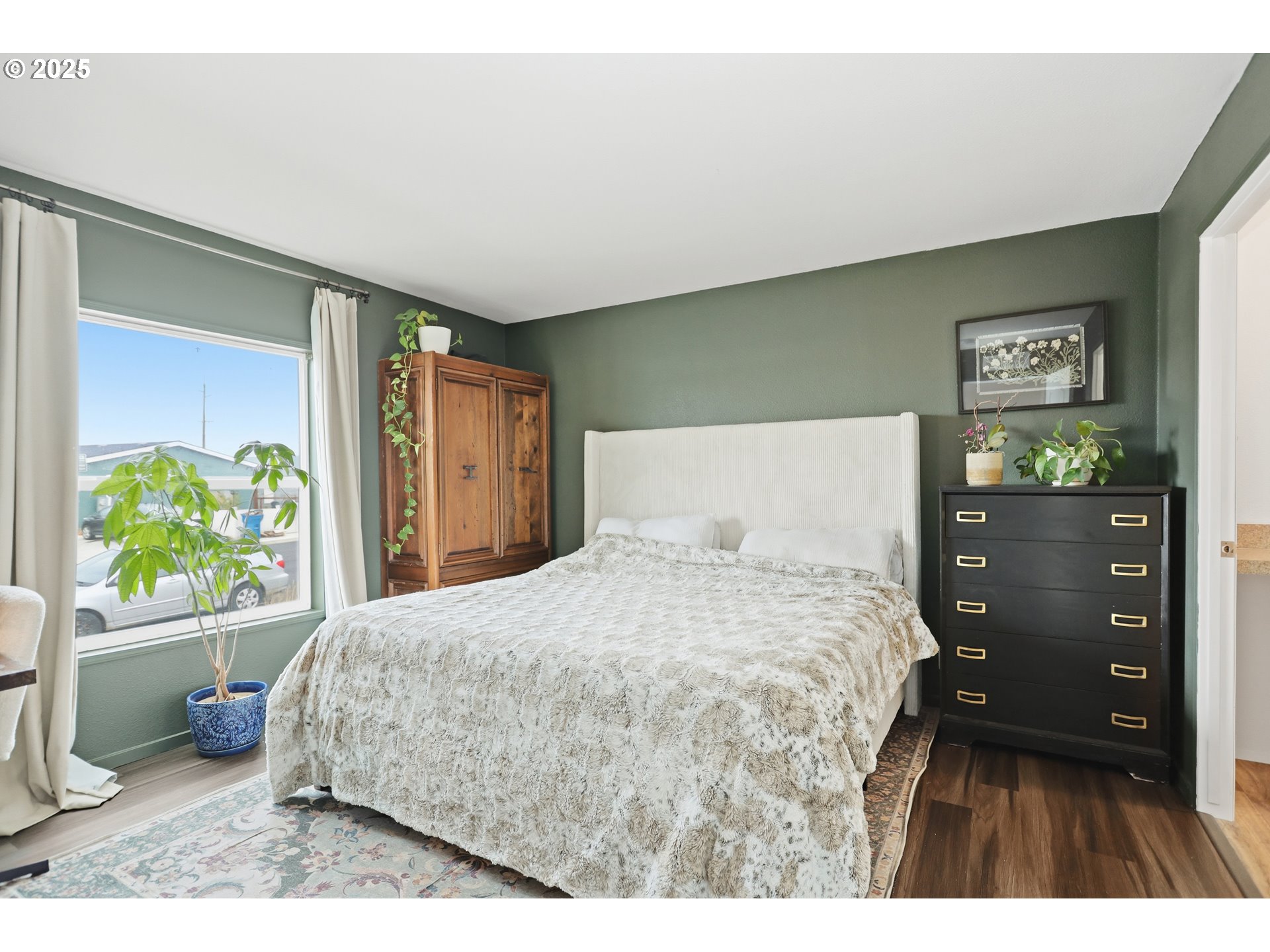 1924 Jaxon Street Goldendale, WA 98620 - Photo 9 of 24 a bedroom with a bed a dresser and a window