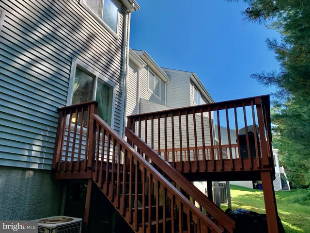 a view of a balcony with wooden floor