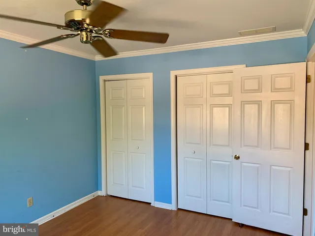 a view of empty room with closet