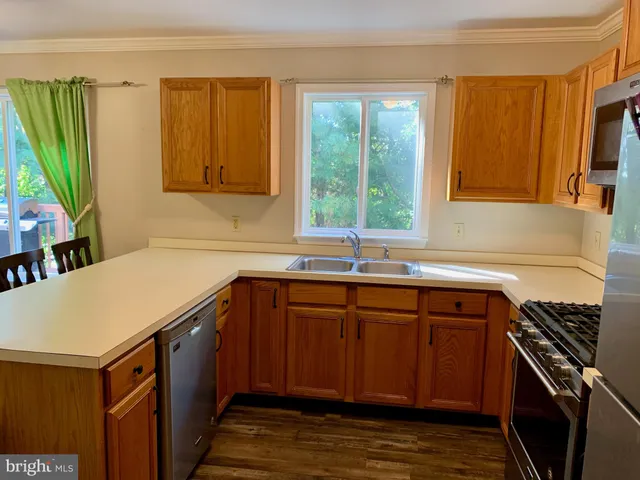 a kitchen with a sink and a stove