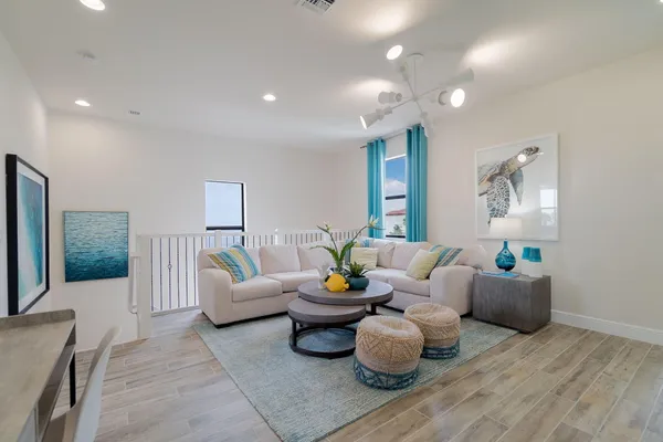 a view of a room with wooden floor