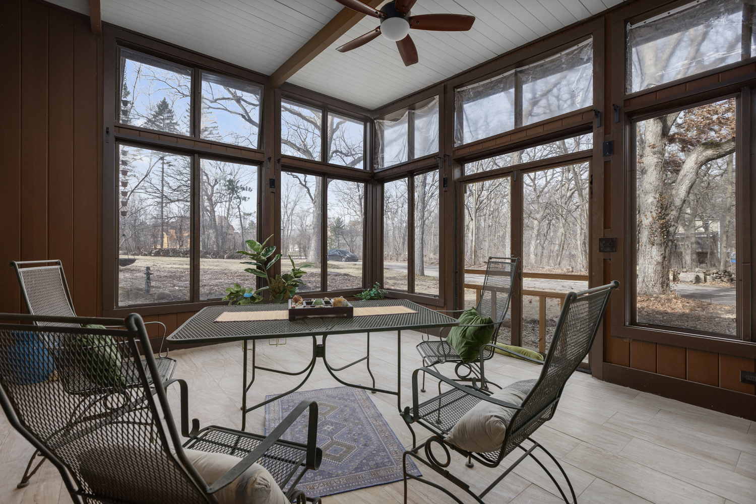 99 Gromer Road Elgin, IL 60120 - Photo 16 of 47 a view of a dining room with furniture large windows and wooden floor