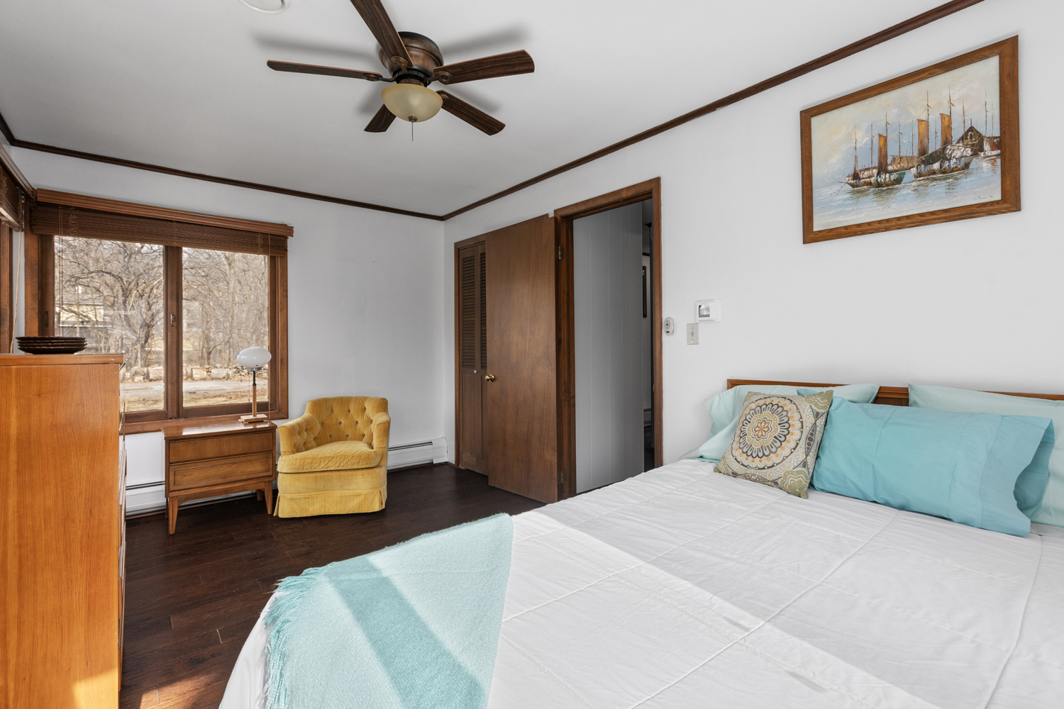 99 Gromer Road Elgin, IL 60120 - Photo 27 of 47 a bedroom with a bed and wooden floor