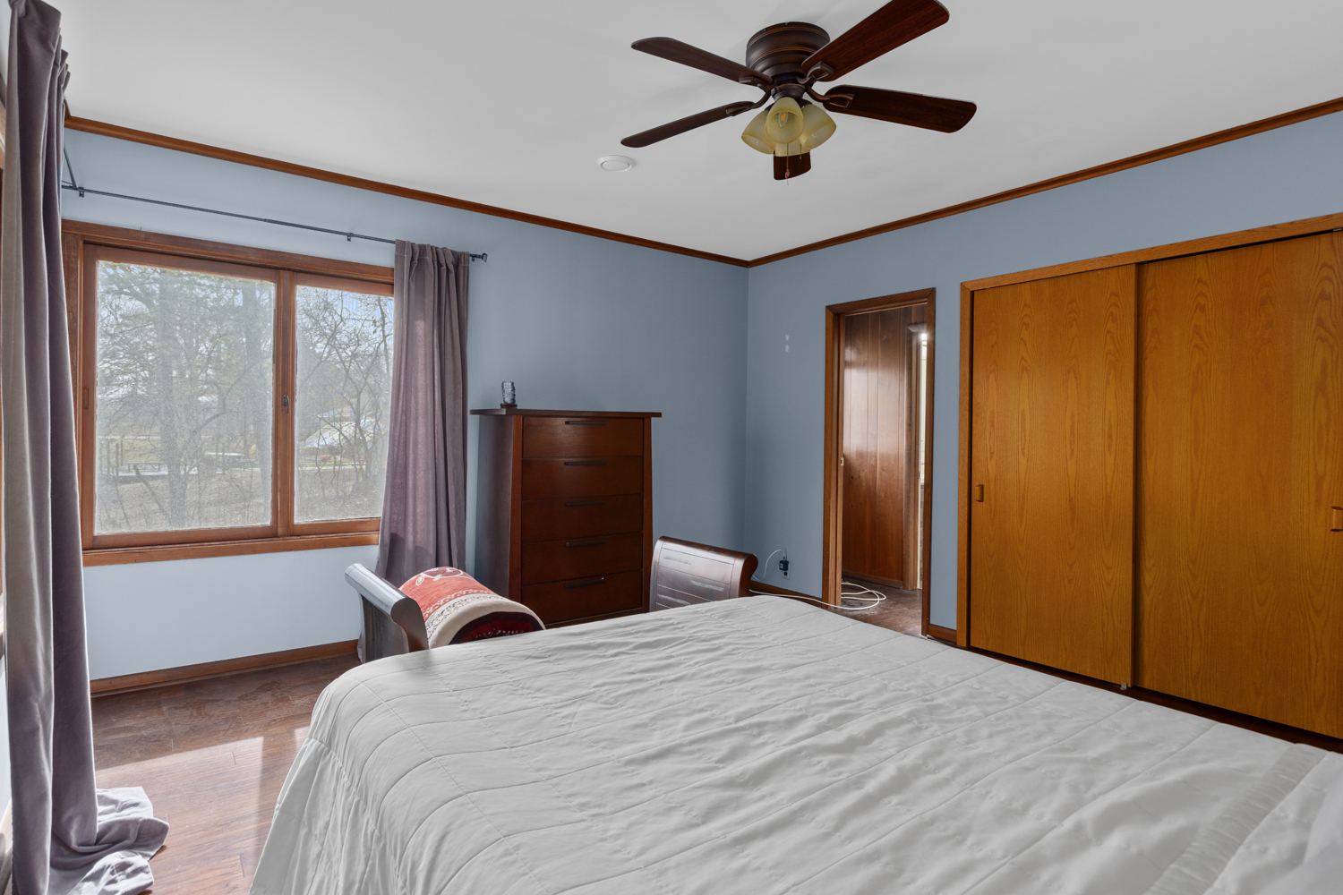 99 Gromer Road Elgin, IL 60120 - Photo 31 of 47 a bedroom with a large bed and a window