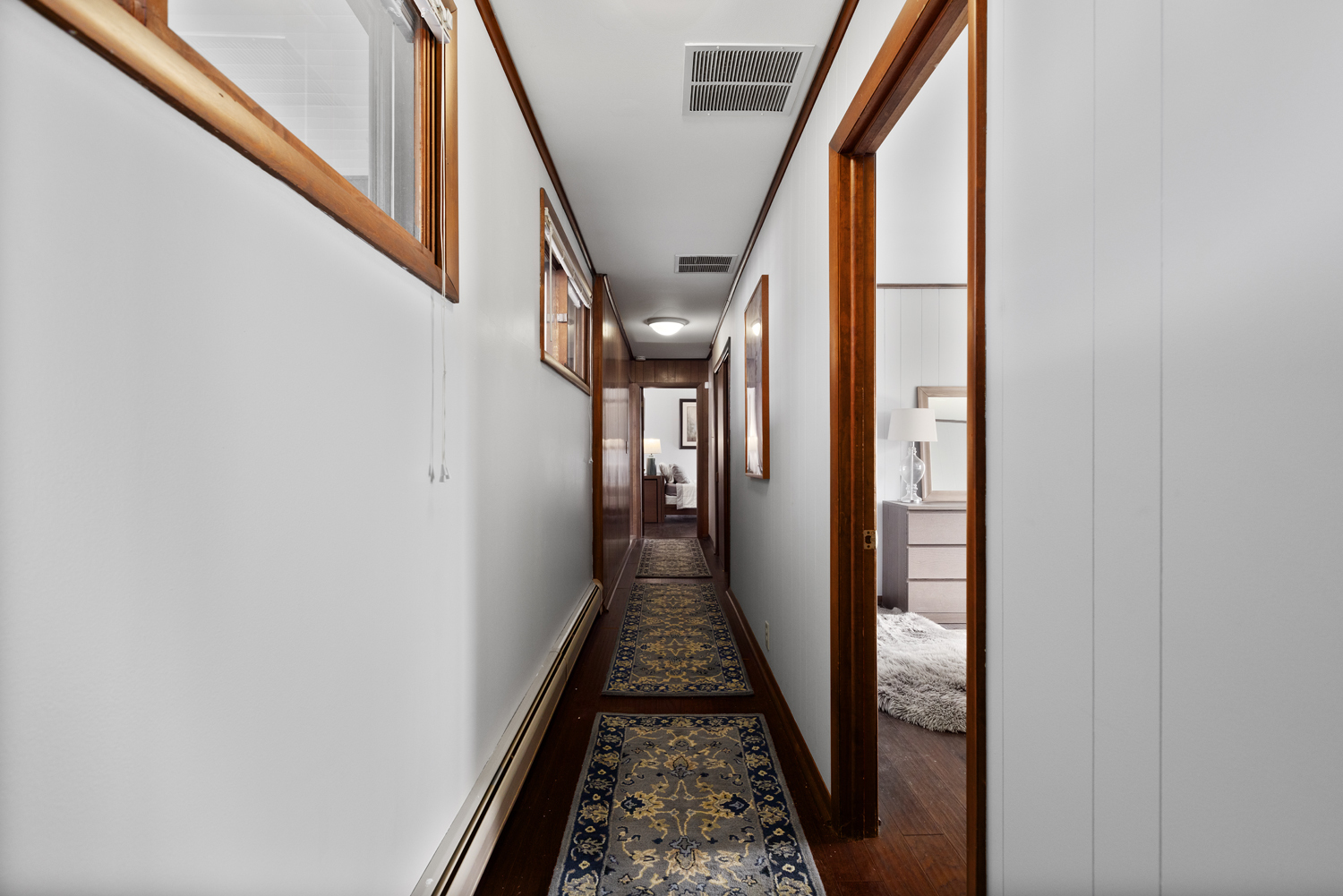 99 Gromer Road Elgin, IL 60120 - Photo 36 of 47 a view of a hallway with wooden floor and staircase