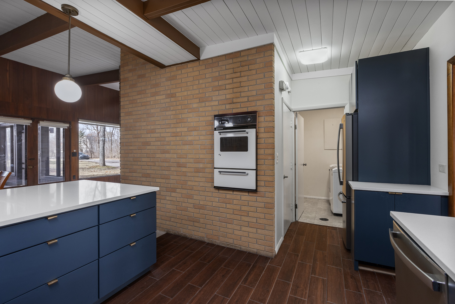 99 Gromer Road Elgin, IL 60120 - Photo 8 of 47 a room with wooden floors and brick walls