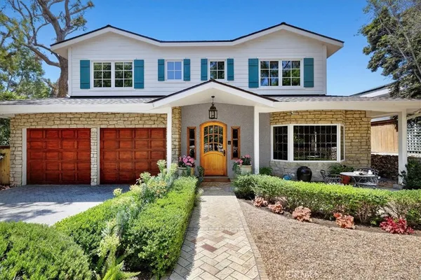 a front view of a house with garden