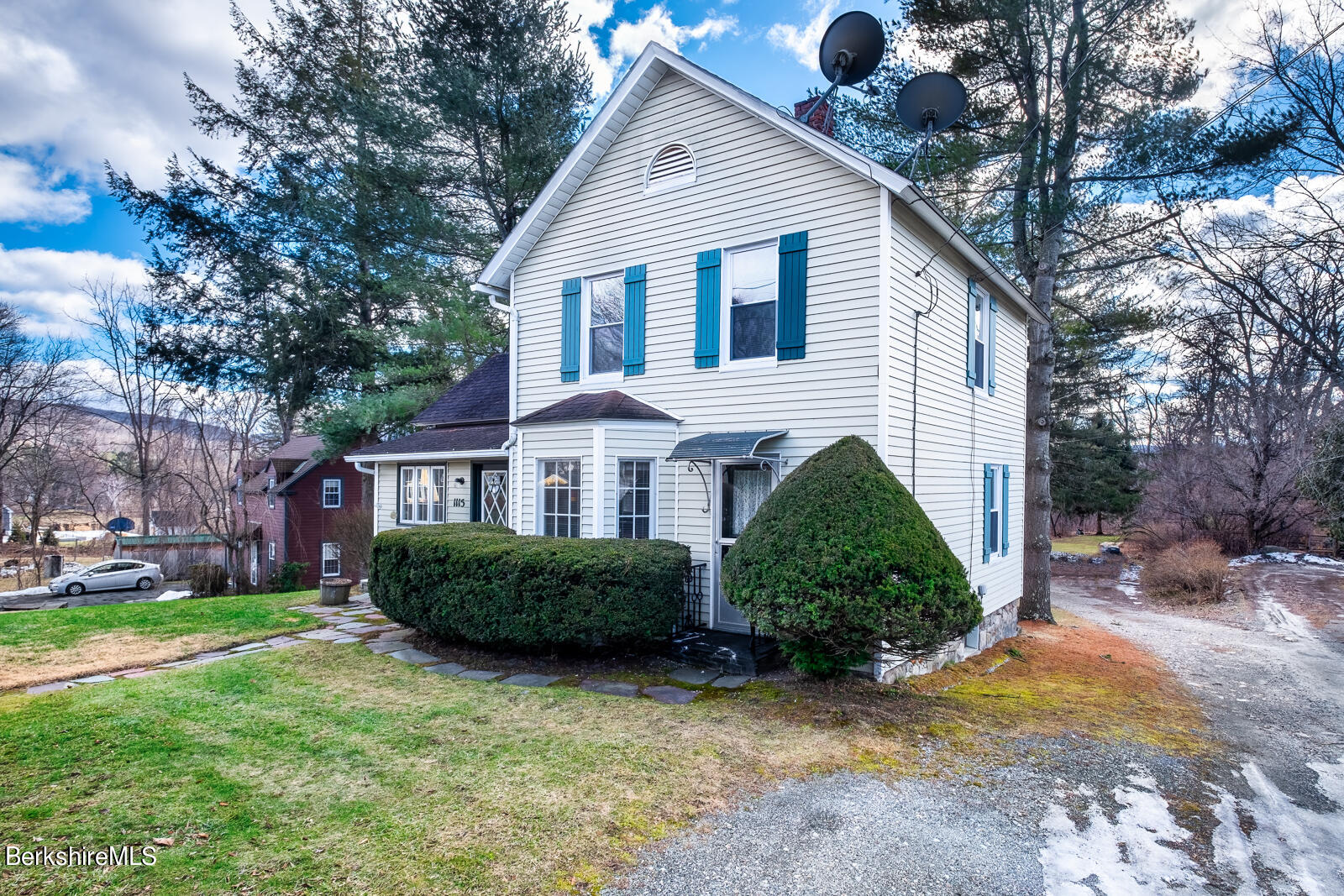 1115 North Hoosac Road Williamstown, MA 01267 - Photo 2 of 16 a front view of a house with garden