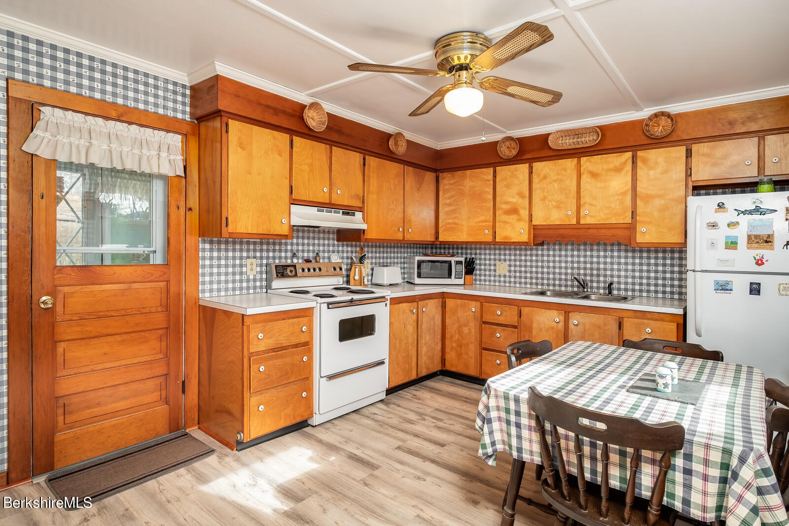 1115 North Hoosac Road Williamstown, MA 01267 - Photo 4 of 16 a kitchen with stainless steel appliances a stove a sink and cabinets