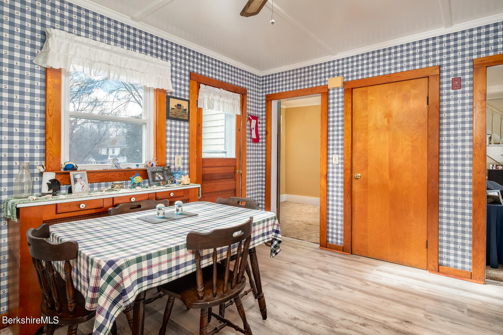 1115 North Hoosac Road Williamstown, MA 01267 - Photo 5 of 16 a view of a dining room with furniture large windows and wooden floor