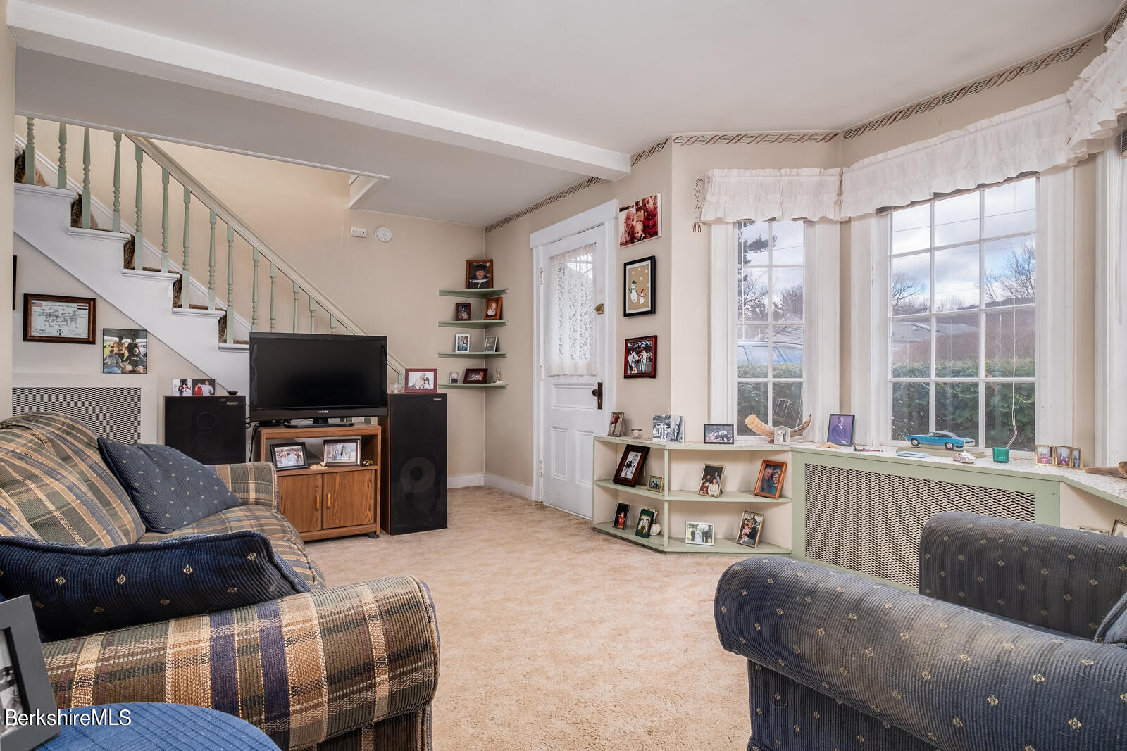 1115 North Hoosac Road Williamstown, MA 01267 - Photo 8 of 16 a living room with furniture and a flat screen tv