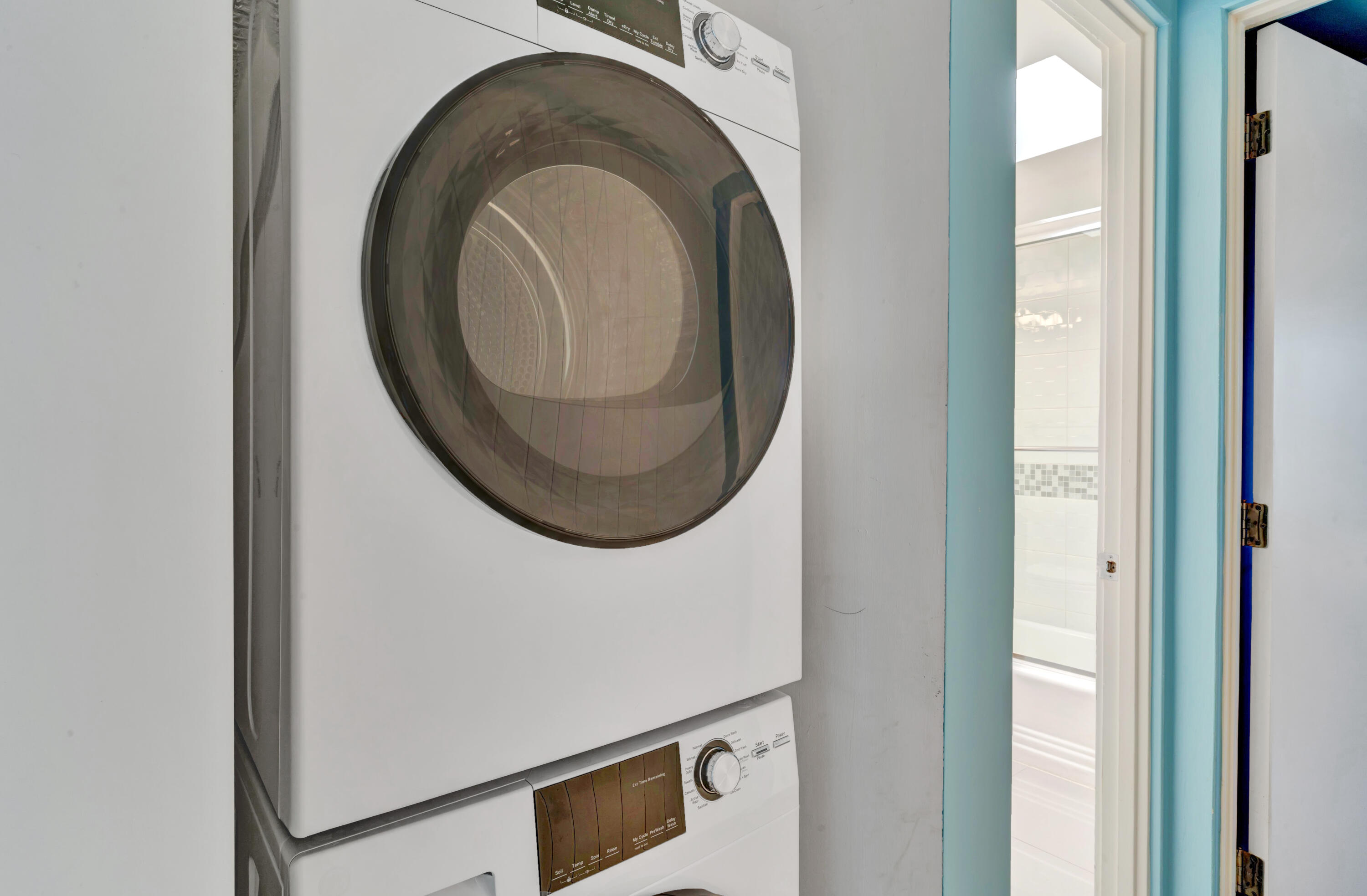 600 East Alexander Way Palm Springs, CA 92262 - Photo 21 of 43 a close view of a utility room with dryer and washer