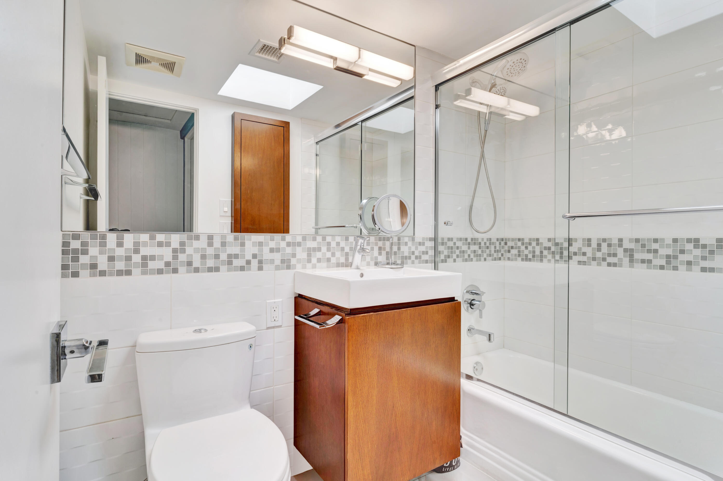 600 East Alexander Way Palm Springs, CA 92262 - Photo 22 of 43 a bathroom with a sink a toilet and a mirror