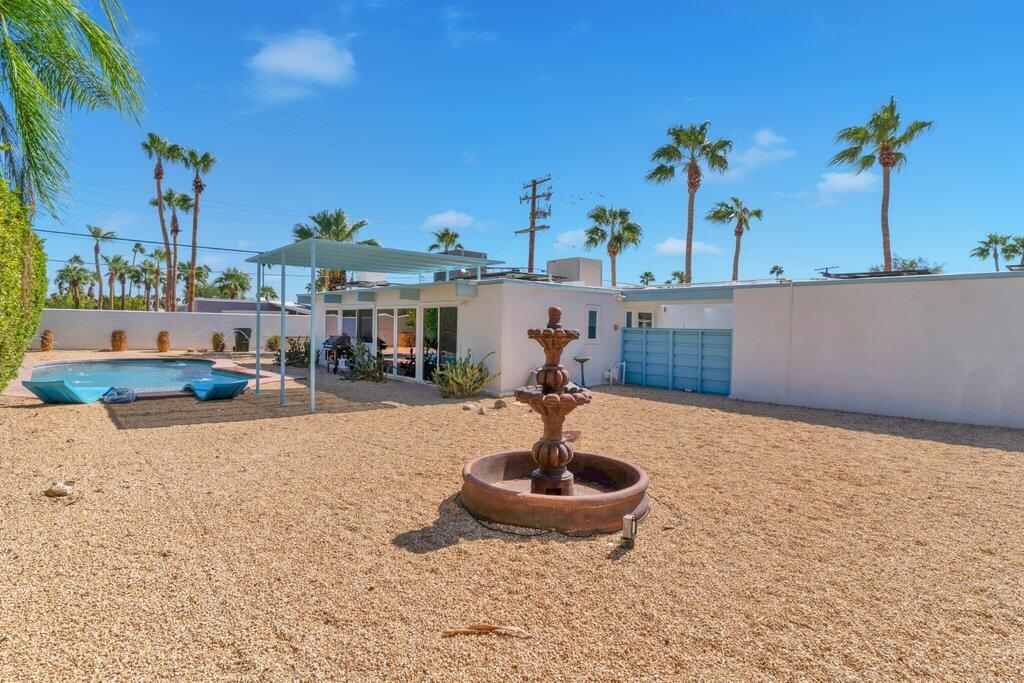 600 East Alexander Way Palm Springs, CA 92262 - Photo 26 of 43 a front view of a house with garden