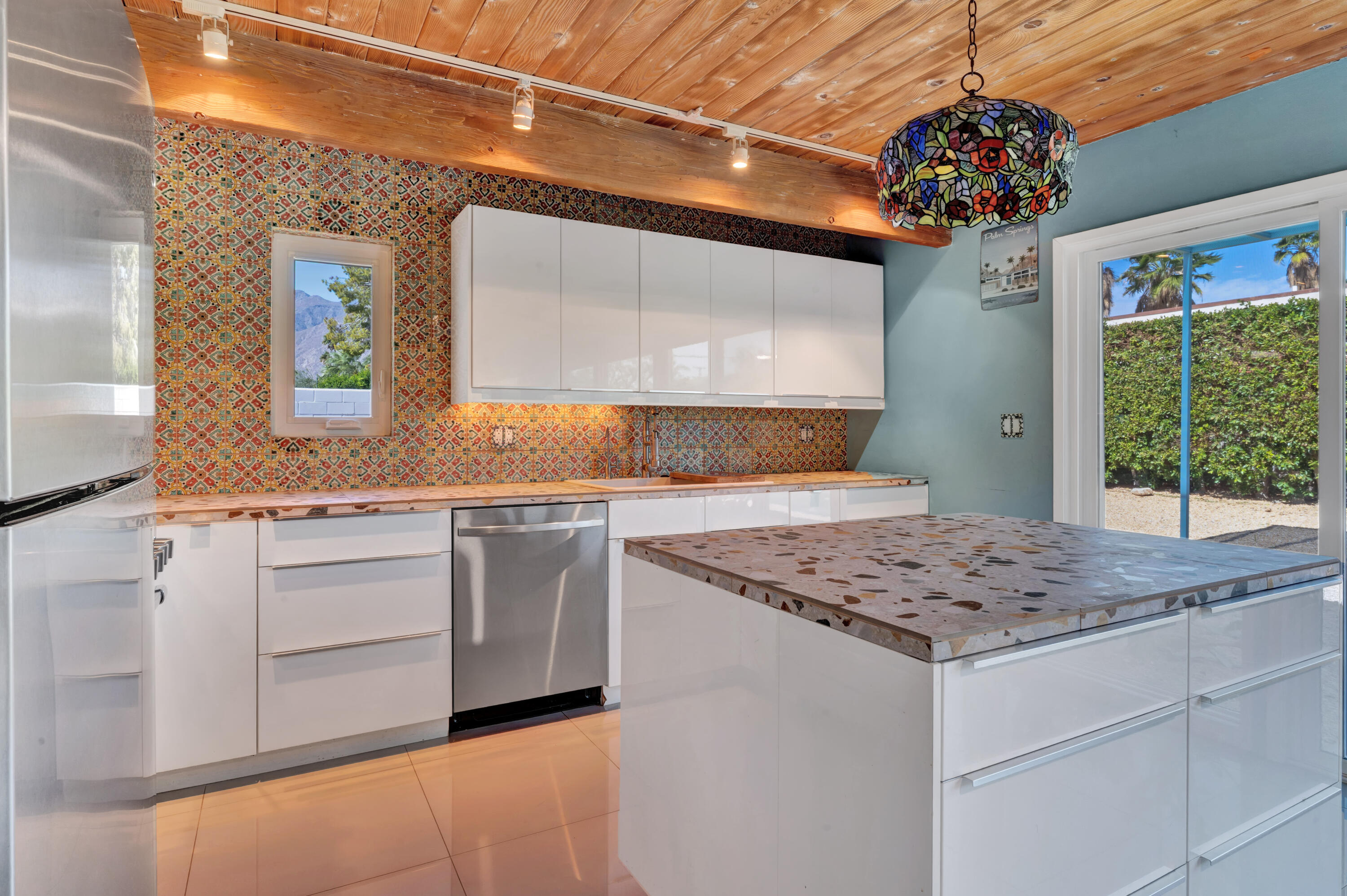 600 East Alexander Way Palm Springs, CA 92262 - Photo 4 of 43 a kitchen with stainless steel appliances granite countertop a sink and a stove