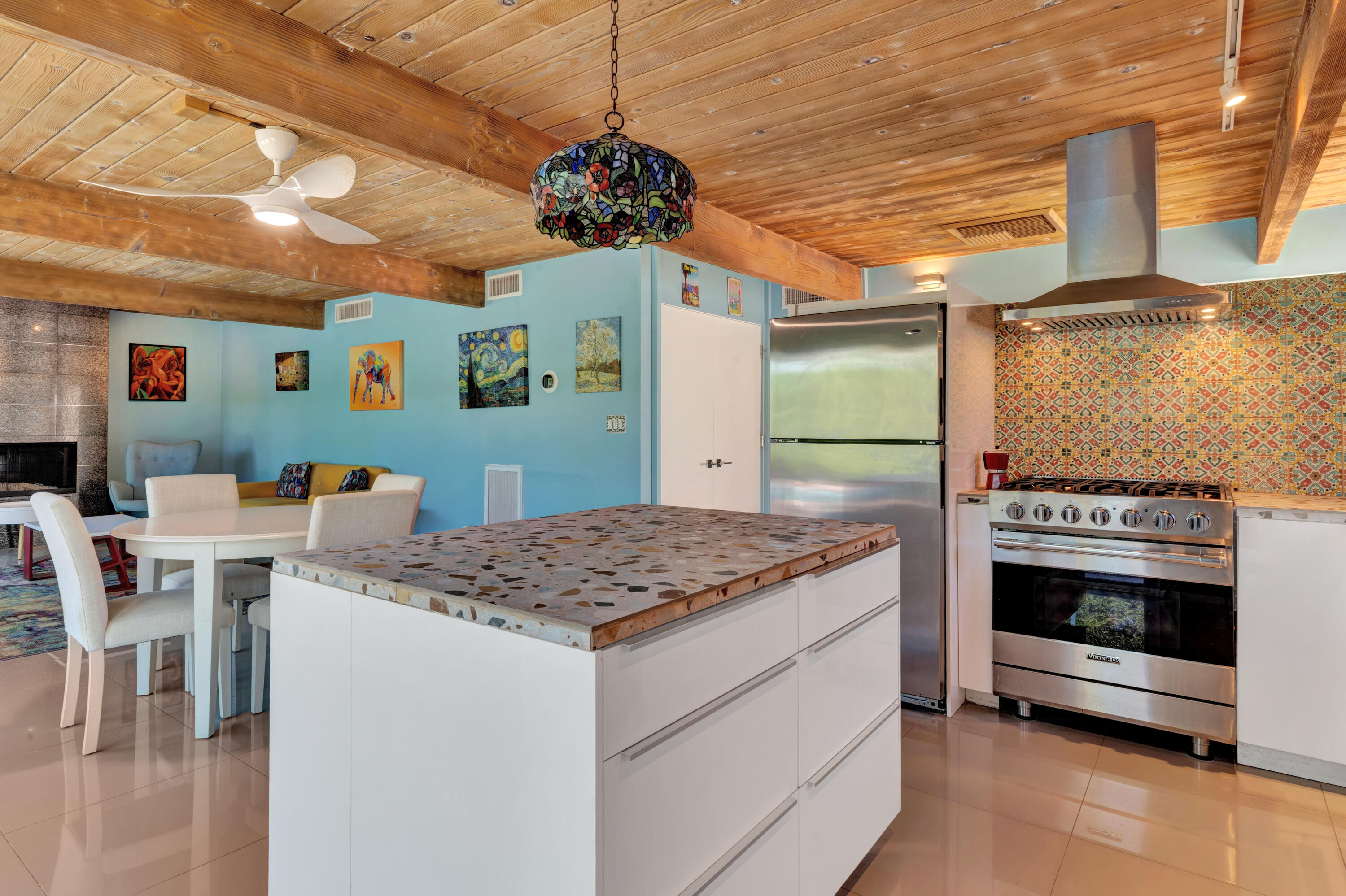 600 East Alexander Way Palm Springs, CA 92262 - Photo 6 of 43 a kitchen that has a stove and a table