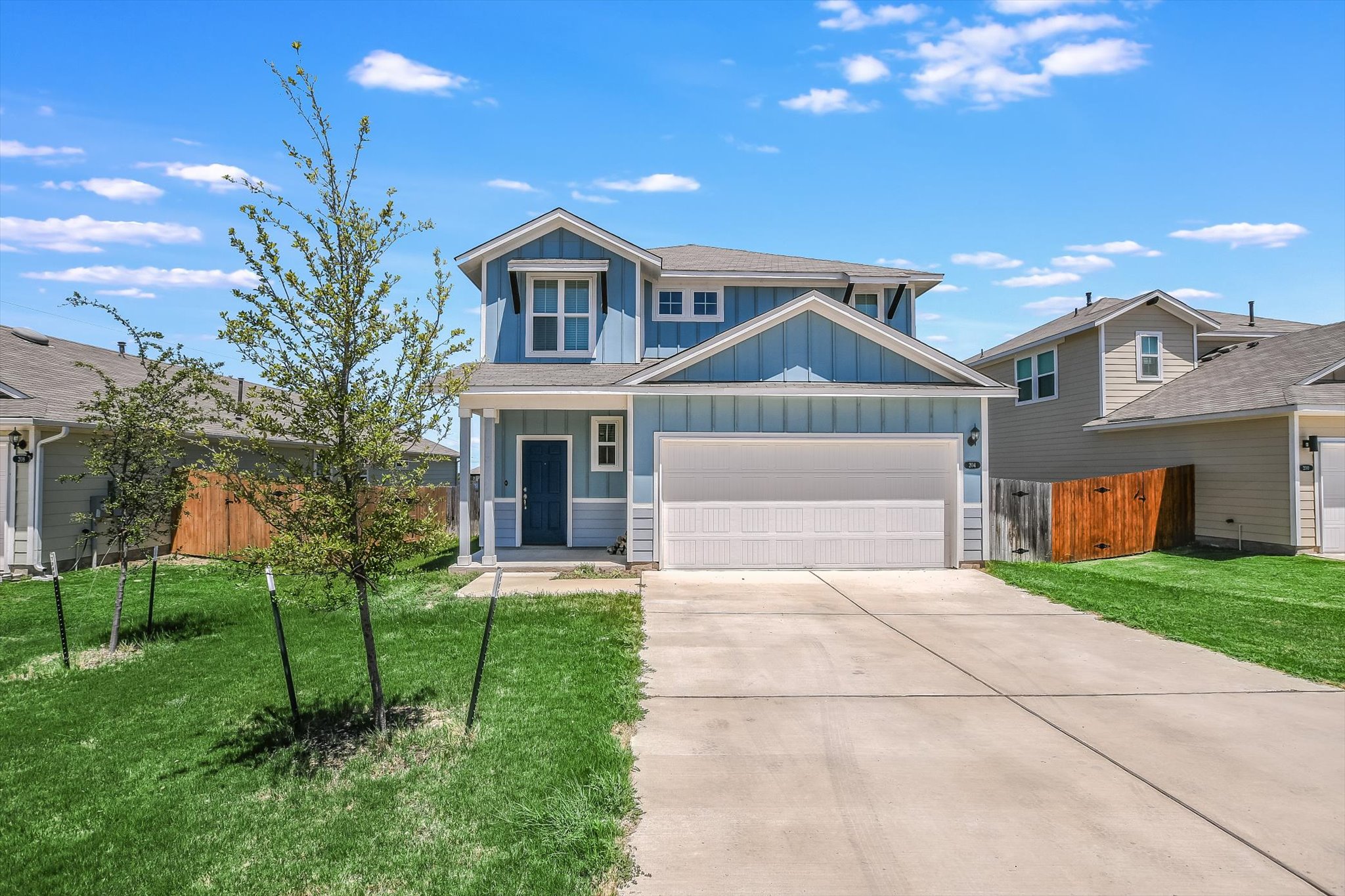 204 Crescent Street Georgetown, TX 78626 - Photo 1 of 12 a front view of a house with a yard and garage