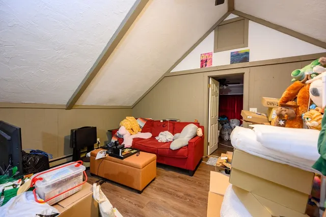 a view of a kitchen with fridge and workspace