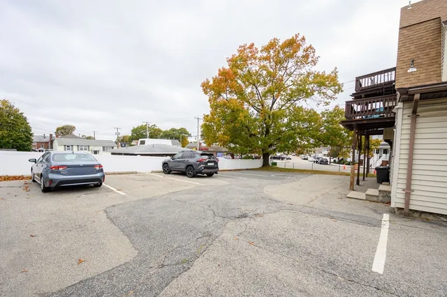a view of a house with sitting area and yard