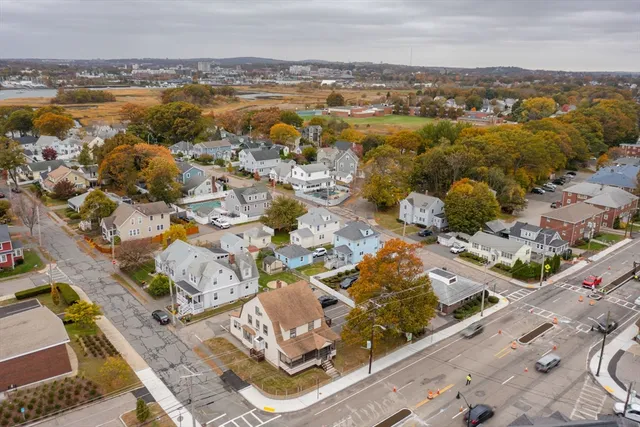 an aerial view of a house with swimming pool