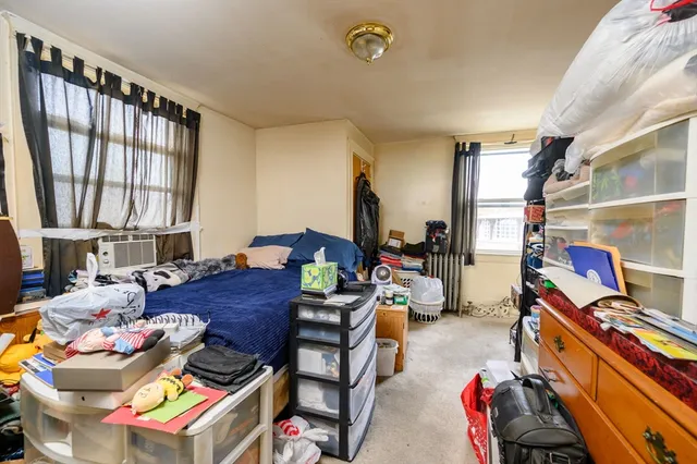 a reading room with furniture and a window