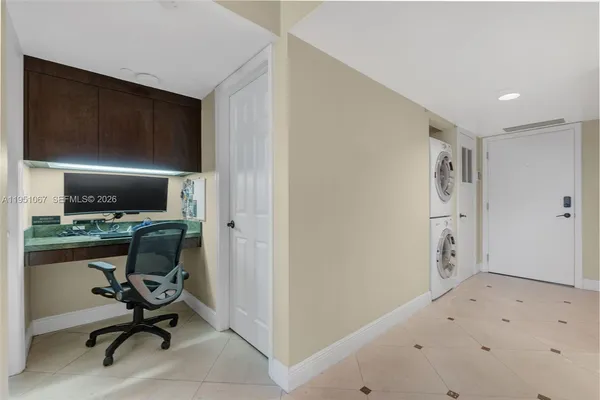 a view of a workspace with furniture